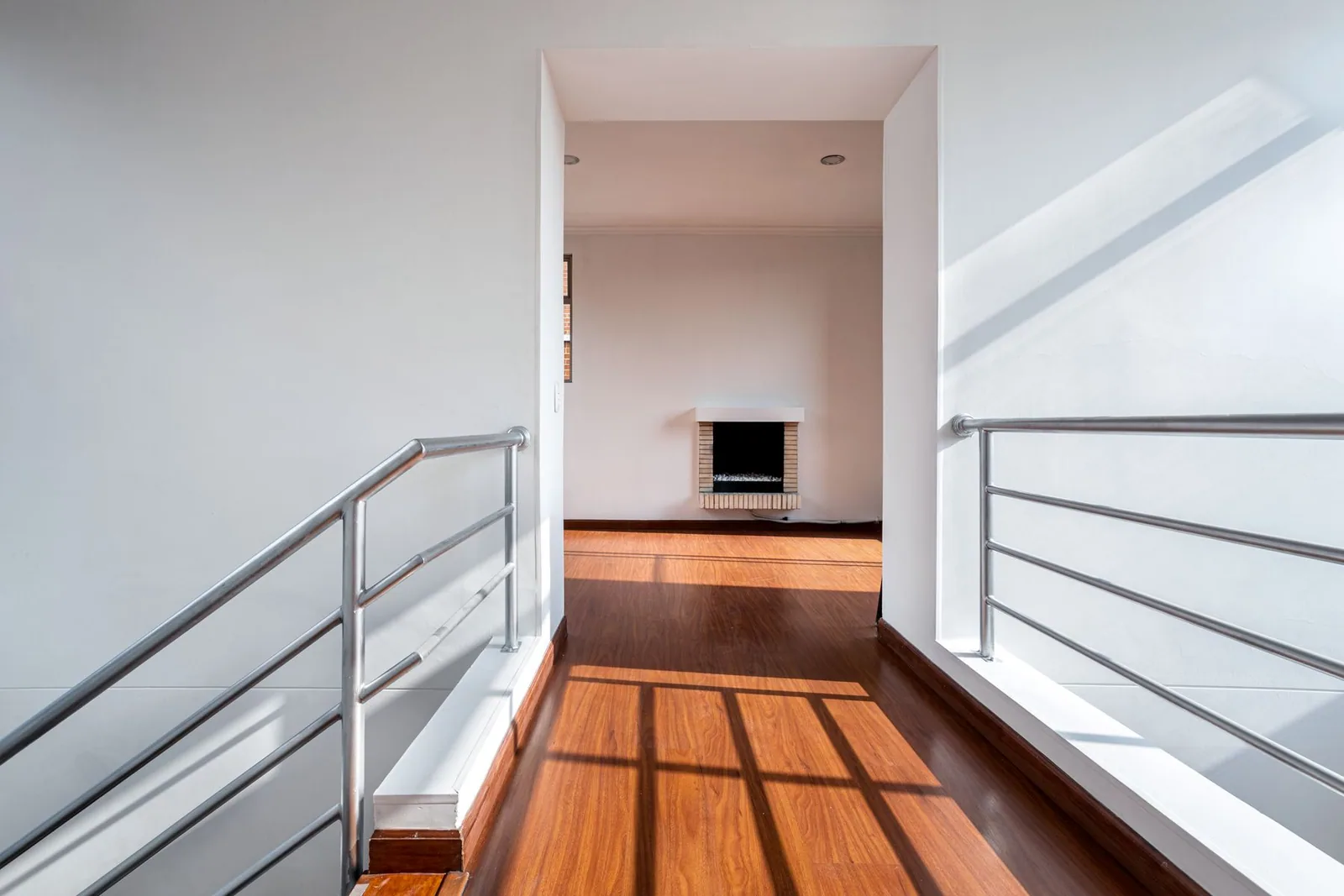 A bright landing with a handrail