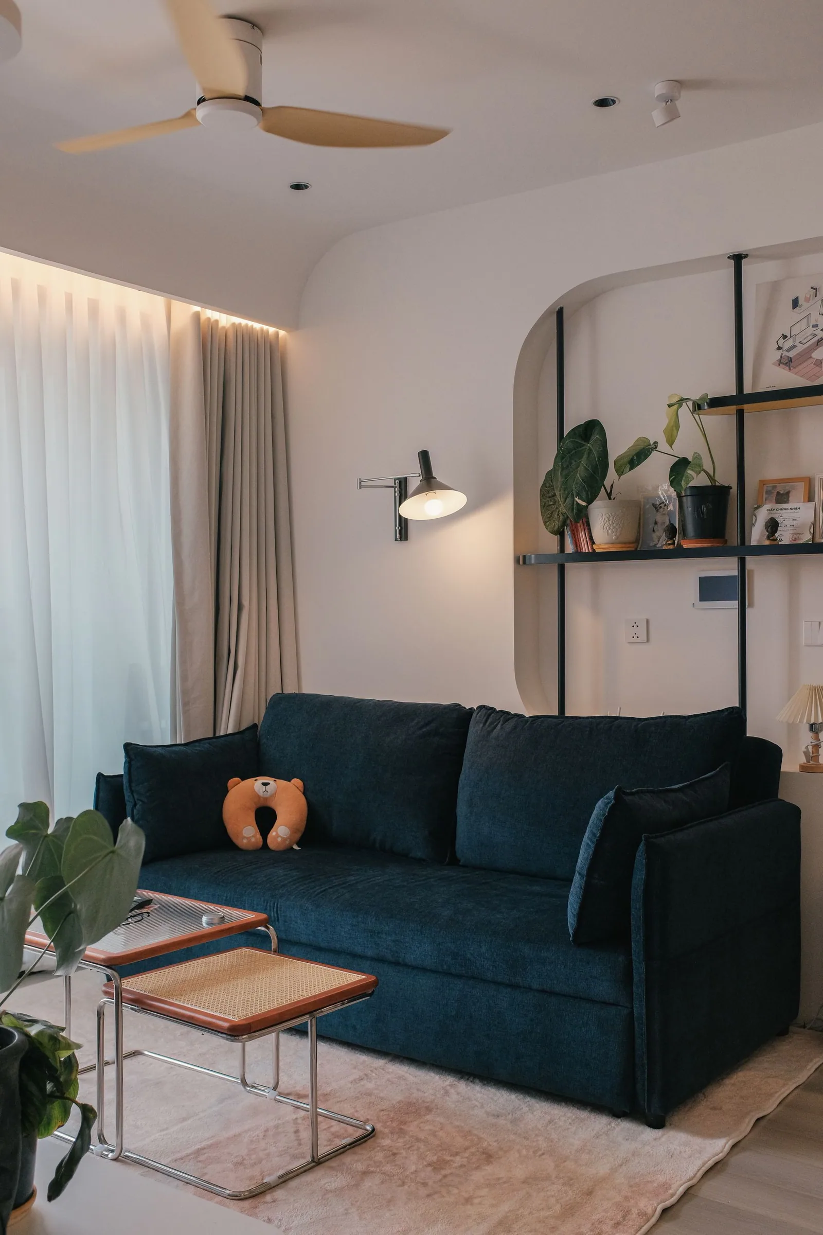 A living room with a blue sofa