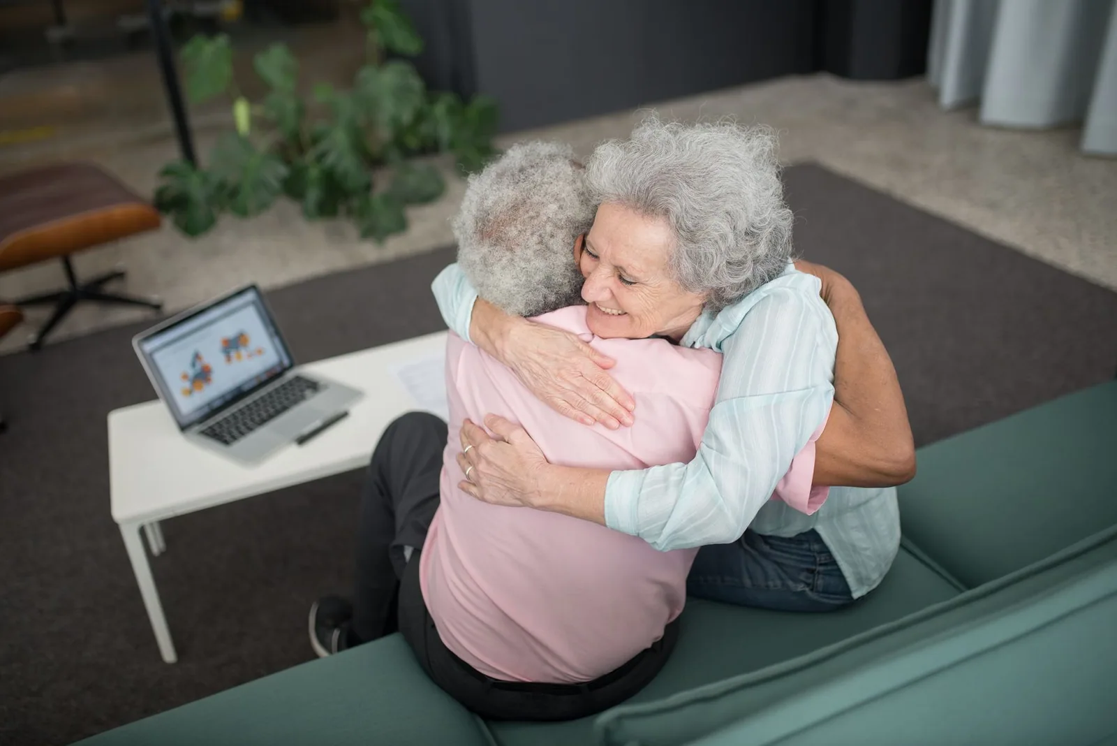 Two people greeting each other at home