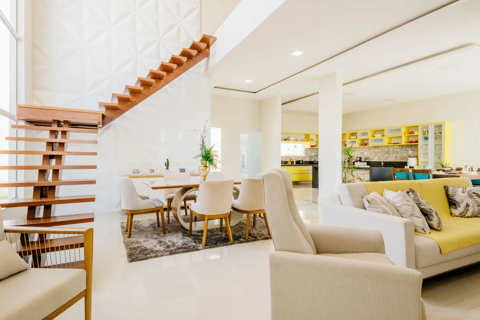 A staircase above an open living space
