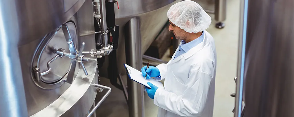 A Kantan technician checking the retort steriliser