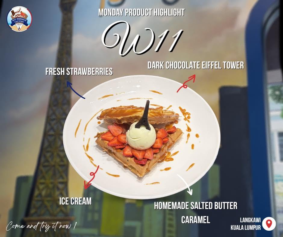 A waffle layered with fresh strawberries and ice cream, finished with dark chocolate and caramel sauce