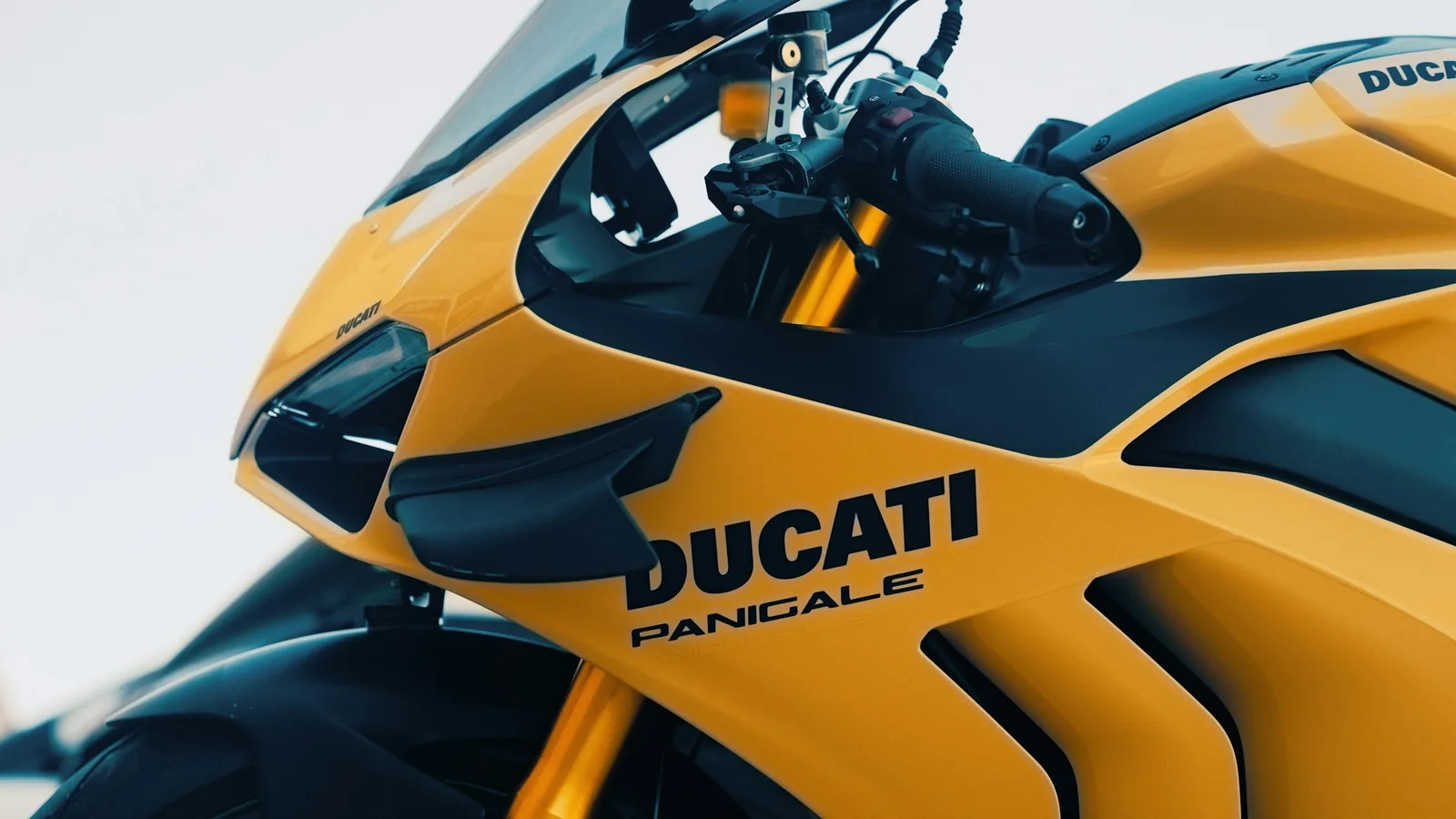 A yellow and black Ducati Panigale motorcycle