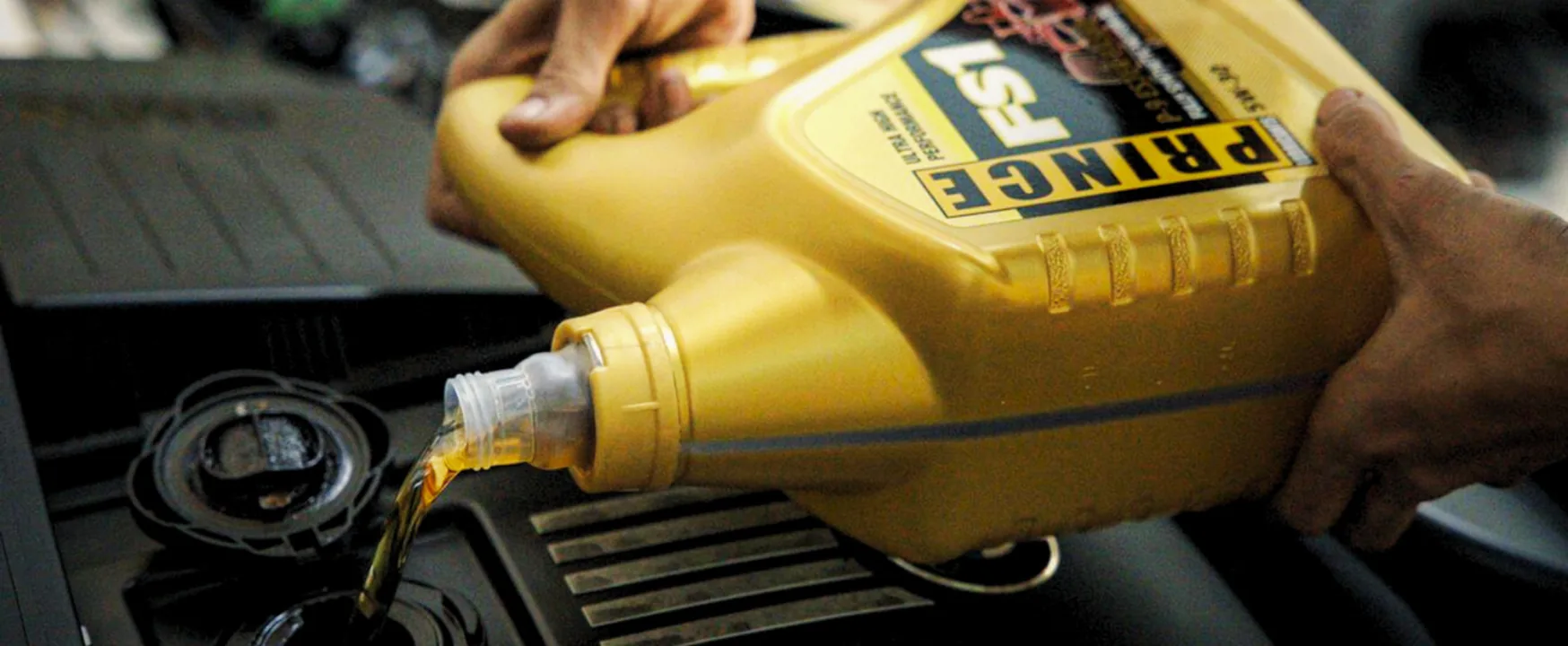 PRINCE FS1 engine oil being poured into an engine