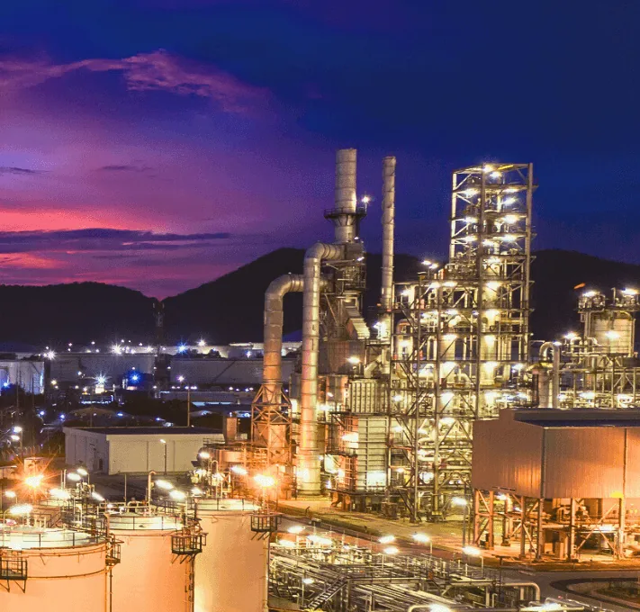 Industrial processing and storage facility lit at night