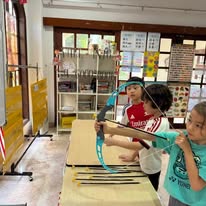 Children at a hands-on activity table indoors